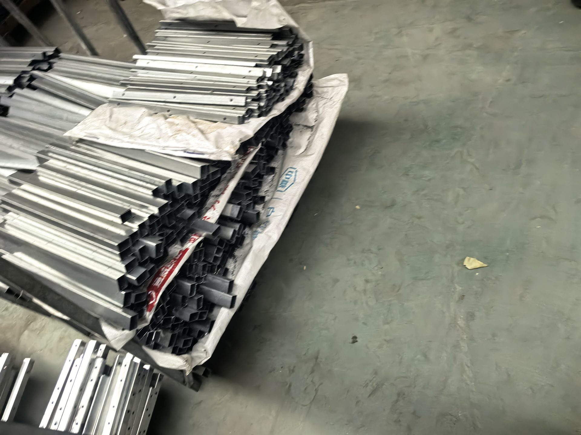 Powder-coated aluminium frames awaiting weaving