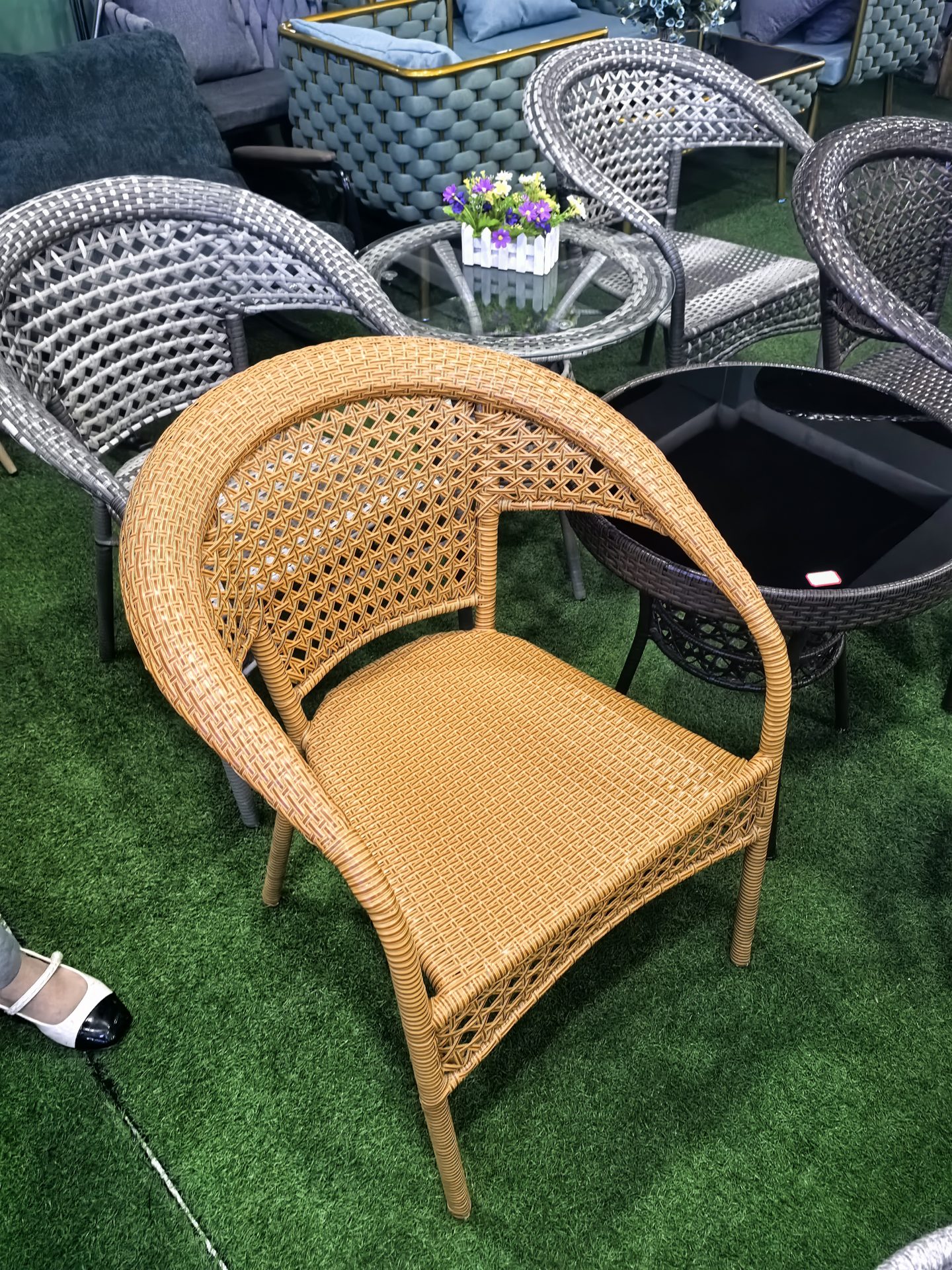 Close-up of a rattan lounge chair showing weave detail
