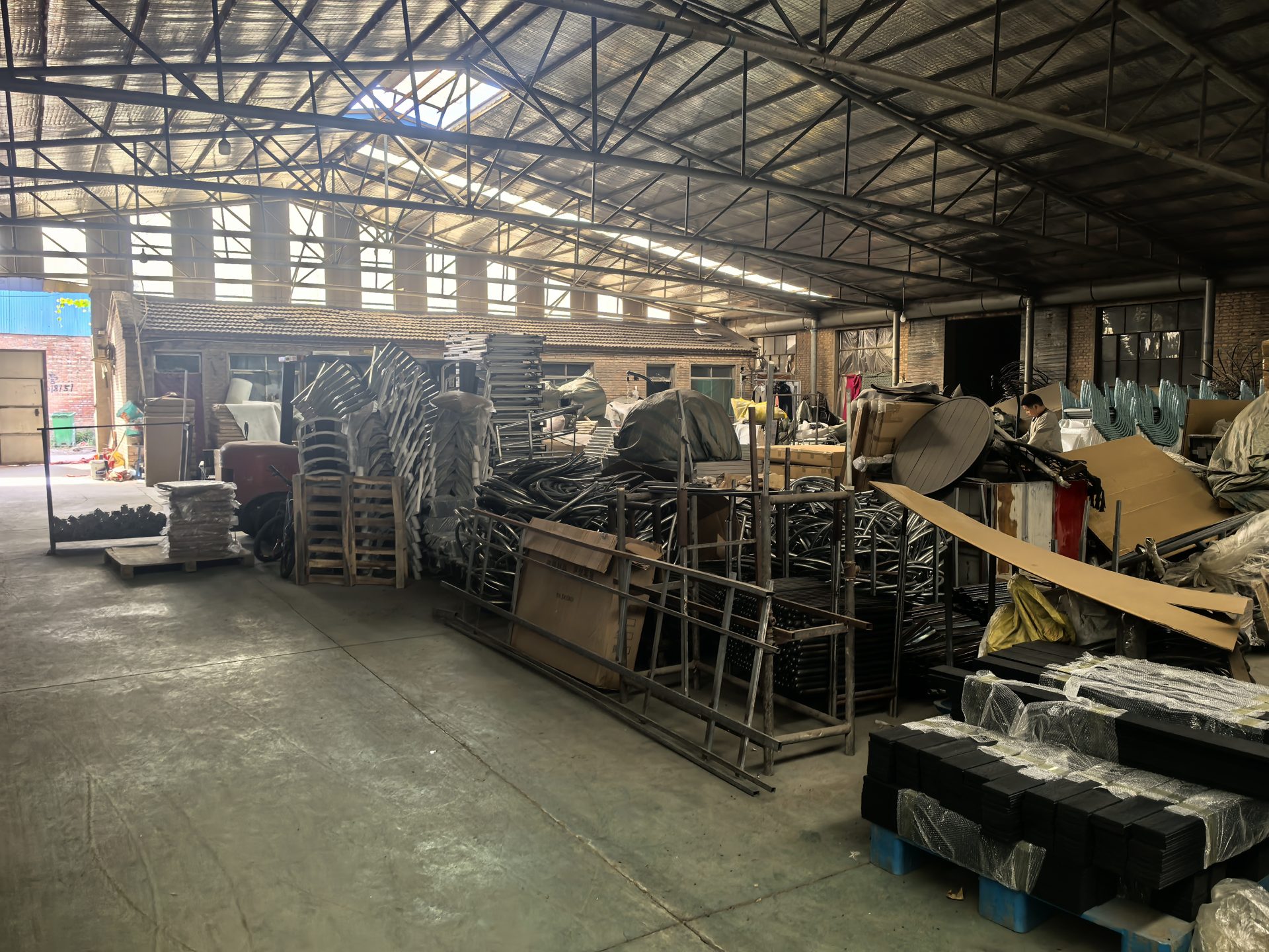 Furniture workshop interior with craftspeople and materials at work
